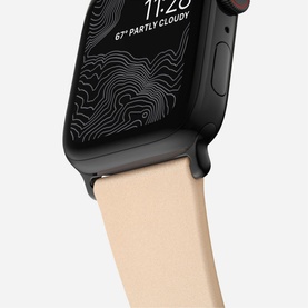 Nomad Modern Slim Strap 40mm/38mm in beige leather attached to black Apple Watch displaying topographic map face
