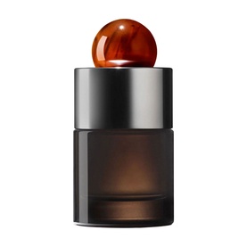 Molton Brown Neon Amber Eau De Parfum in dark amber-tinted glass bottle with silver collar and glossy amber sphere cap