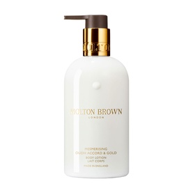 Molton Brown Mesmerising Oudh Accord & Gold Hand Lotion in white pump bottle with gold pump dispenser