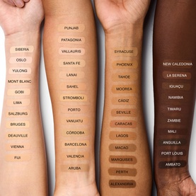 Nars Natural Radiant Longwear Foundation shade range swatched across multiple arms showing all available skin tone shades with names.