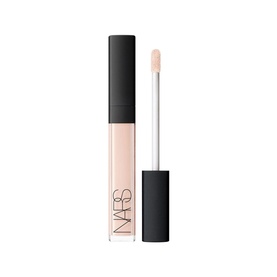 NARS Radiant Creamy Concealer in light peach nude shade, shown with open doe-foot applicator wand beside black tube packaging