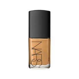 NARS Sheer Glow Foundation in Cadiz, medium-tan shade in glass bottle with black cap