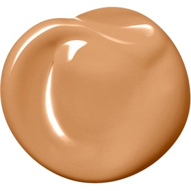 NARS Sheer Glow Foundation in Cadiz, warm golden-tan shade shown as a glossy cream swatch