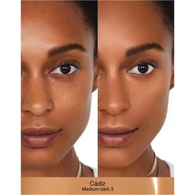 NARS Sheer Glow Foundation in Cadiz shade shown in before and after split image on medium-dark skin tone model's face