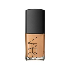 NARS Sheer Glow Foundation in Huahine, medium-tan shade in a glass bottle with black cap