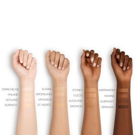 NARS Pure Radiant Tinted Moisturiser SPF 30 shade range swatched across four arms in varying skin tones, Havana shown on deep skin tone