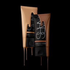 NARS Pure Radiant Tinted Moisturiser SPF 30 in Havana, 50ml, two tubes with product dripping shown against black background