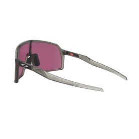Oakley Shield Sunglasses 0OO9406 in grey with wrap-around frame, pink-tinted single lens and red accent detail, side angle view