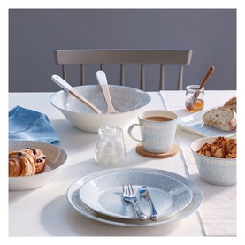 Royal Doulton Herringbone Pasta Bowl in pale blue herringbone pattern, styled on a dining table with matching plates, mugs, and bowls