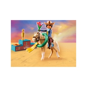Playmobil Rodeo Pru figure riding a palomino horse with lasso, trophy, and rodeo chest accessories in multicolour set