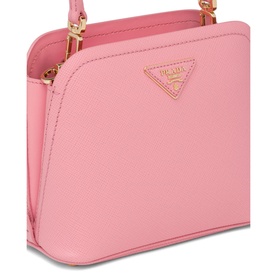 Prada Accessories Matin&eacute;e Saffiano Leather Micro Bag in pink with gold-tone triangle logo and adjustable shoulder strap visible