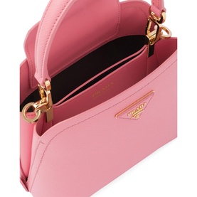 Prada Accessories Matin&eacute;e Saffiano Leather Micro Bag in pink, open top view showing interior, gold-tone hardware and logo triangle detail