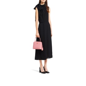 Model carrying Prada Accessories Matin&eacute;e Saffiano Leather Micro Bag in pink with gold hardware, styled with black midi dress and heels