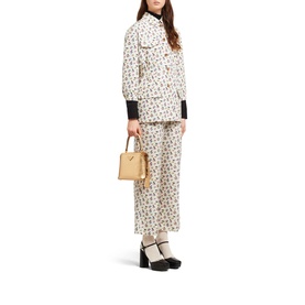Model carrying Prada Accessories Matin&eacute;e Saffiano Leather Micro Bag in grey, styled with cream floral co-ord and black heels