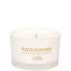 Rathbornes Dublin Tea Rose Travel Candle in frosted white glass vessel with gold logo branding and single wick
