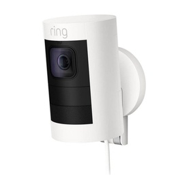 Ring Stick Up Cam Wired in white, wall-mounted plug-in security camera with lens and cable visible
