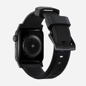 Nomad Rugged Strap 40mm/38mm in black, shown fitted to an Apple Watch, rear view highlighting textured silicone band and buckle clasp