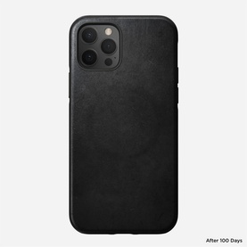 Nomad Rugged Case MagSafe iPhone 12/12 Pro in black leather, shown after 100 days of wear, back view with camera cutout