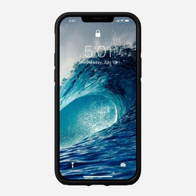 Nomad Rugged Case MagSafe iPhone 12/12 Pro in black, shown fitted to phone displaying ocean wave lock screen
