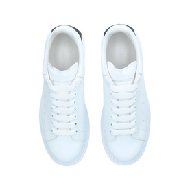 Alexander McQueen Show Drop Tab Trainers in white leather with silver heel tab and white laces, overhead view