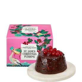 Fortnum & Mason St James Christmas Pudding 227g on marble plate, topped with cranberries, beside signature pink illustrated gift box