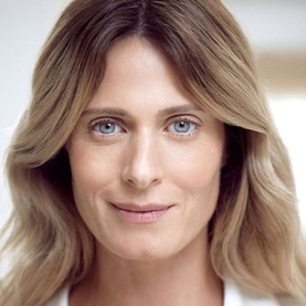 Model with Sisley Sisle&yuml;a L'Int&eacute;gral Anti-&Acirc;ge Firming Concentrated Serum, close-up showing smooth, radiant complexion