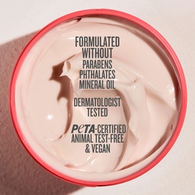 Sol De Janeiro Bom Dia Bright Body Cream open jar showing pale pink cream texture with PETA-certified, vegan and dermatologist tested claims.
