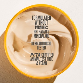 Sol De Janeiro Brazilian Bum Bum Cream, overhead view showing creamy beige texture with PETA-certified, vegan and paraben-free credentials