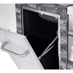 Grandhall Stone Island Outdoor Kitchen built-in storage drawer open, revealing black interior, with silver pull handle