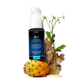 Sunday Riley A+ High-Dose Retinoid Serum pump bottle styled with prickly pear, ginger root and white flowers