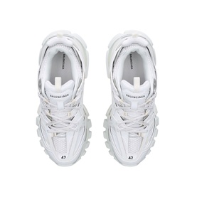 Balenciaga Track Trainers in white, overhead view showing multi-panelled upper, cord-style double laces, and chunky layered rubber outsole