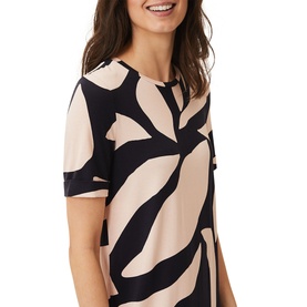 Model wearing Phase Eight Theresa Abstract Print Dress in pink and navy, short sleeves, close-up of bodice detail
