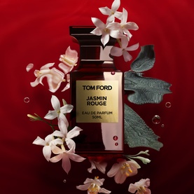 TOM FORD Jasmin Rouge Eau de Parfum 100ml bottle surrounded by white jasmine flowers on a deep red background