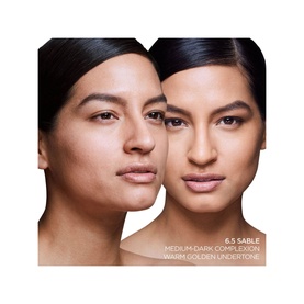 TOM FORD Traceless Soft Matte Foundation in 6.5 Sable shown on two models demonstrating medium-dark complexion with warm golden undertone