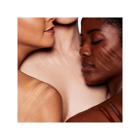 TOM FORD Traceless Soft Matte Foundation swatches shown across three models with varying skin tones, demonstrating shade range