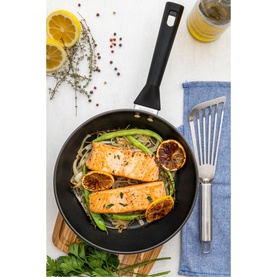 Tramontina Brava Bakelite 4-Piece Cookware Set, silver non-stick frying pan with seared salmon, green beans and caramelised lemon