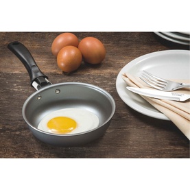 Tramontina Egg Frying Pan 13cm in dark grey aluminium with non-stick interior, black Bakelite handle, shown with fried egg on wooden surface