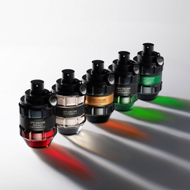 Viktor & Rolf Spicebomb Extreme EDP 50ml collection of five bottles with red, gold, black, green and clear bases, casting coloured shadows