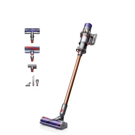 Dyson Home V10 Cyclone Absolute Cordless Stick Vacuum Cleaner in copper, shown with multiple attachments including floor and crevice tools