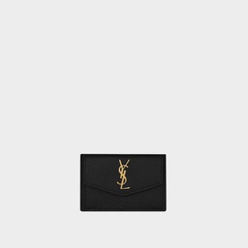 Saint Laurent Uptown Embossed Leather Card Case in black grain de poudre leather with gold YSL monogram and snap button closure
