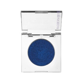 Urban Decay 24/7 Moondust Shadow in Charged, open compact revealing deep blue metallic shimmer eyeshadow with mirror lid