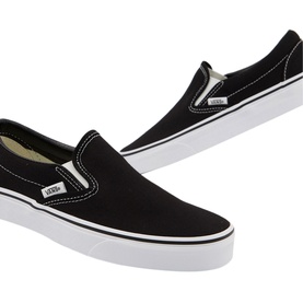 Vans Classic Slip On Trainers in black canvas with white sole, elastic side gussets and contrast white stitching, shown as a pair