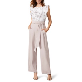 Model wearing Phase Eight Victoriana Printed Jumpsuit in cream with floral ruffle top, wide-leg trousers and tie waist belt