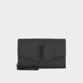 Saint Laurent Uptown Embossed Leather Chain Wallet in black with tonal YSL logo, envelope flap, and gunmetal chain strap