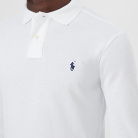Model wearing Ralph Lauren Long Sleeve Slim Fit Polo Shirt in white, showing embroidered pony logo, pointed collar and button fastenings