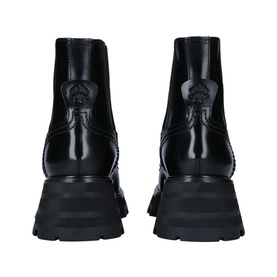 Alexander McQueen Wander XL Boots in black leather, rear view showing logo-embossed heel tab and chunky platform sole