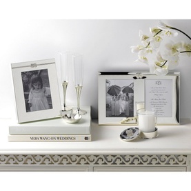 Wedgwood Infinity Small Photo Frame in silver, 4x6 inch, styled with matching frame, candle, and white orchids on white dresser