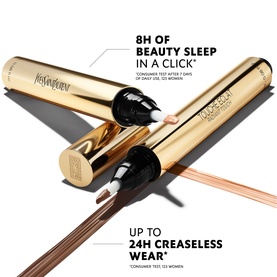 Yves Saint Laurent Touche Eclat concealer pen in gold packaging, shown open with applicator tip visible against white background