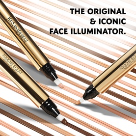 Yves Saint Laurent Touche Eclat illuminating pen concealers in gold packaging, shown open and closed on a striped background