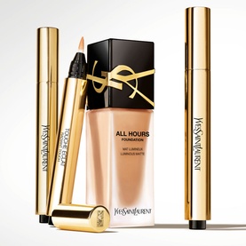 Yves Saint Laurent Touche Eclat concealer in gold packaging, styled with All Hours Foundation and eyeliner pencils